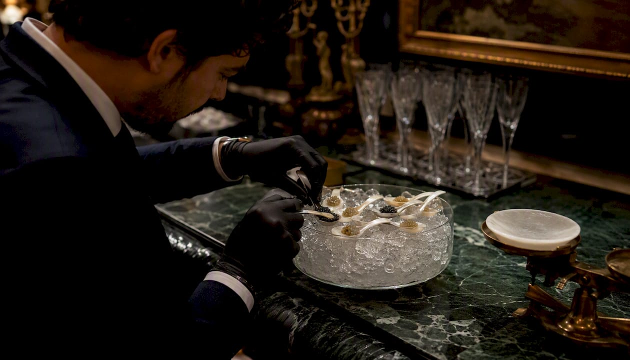 Sommelier measuring caviar portions