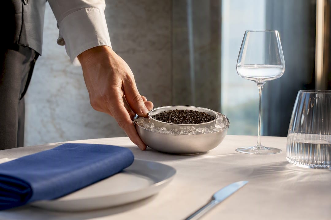 Caviar service vessel on linen table