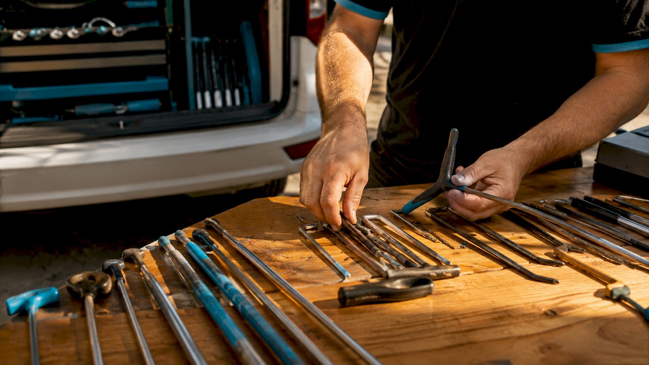 Close-up of hands holding PDR rods and picks outdoors