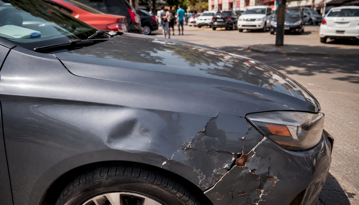Comparison of shallow car dent and damaged panel