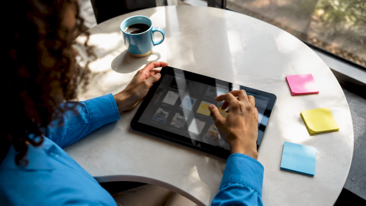 Close-up of hands organizing digital insurance files