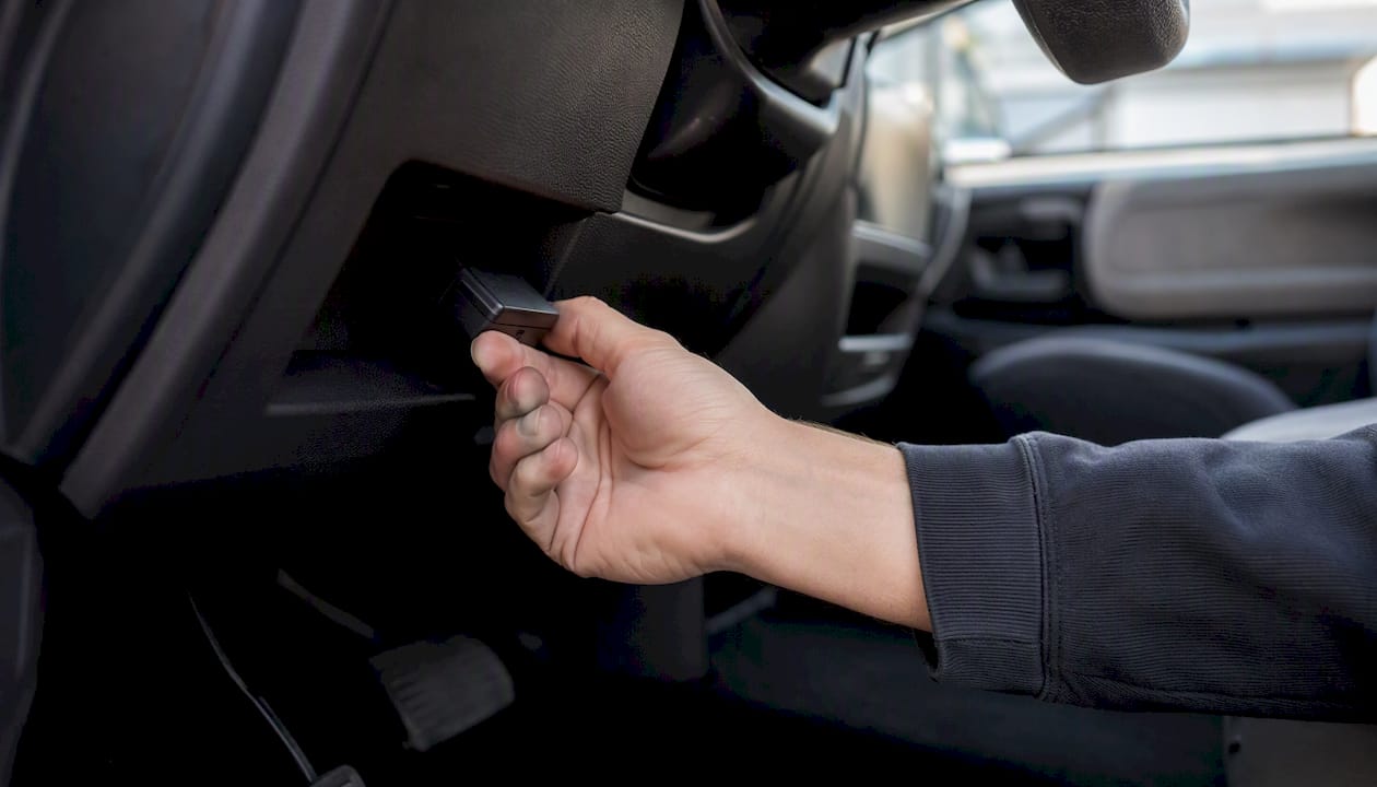 Hand installing vehicle telematics device