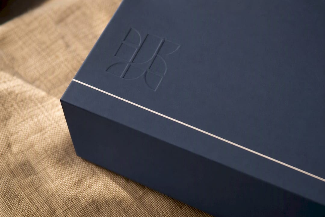 Blind debossed matte gift box with gold foil accent