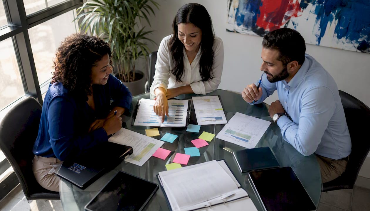 Team discussing property compliance operations