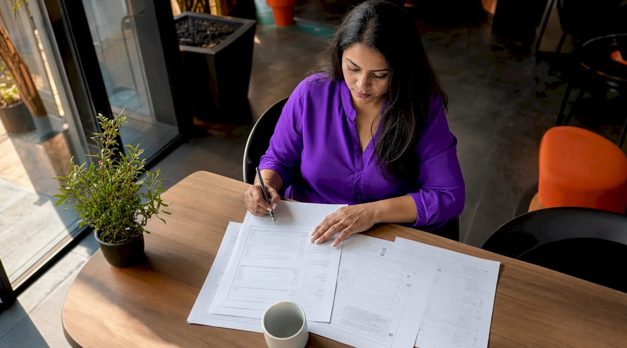 Person reviewing ISO 27001 compliance documents