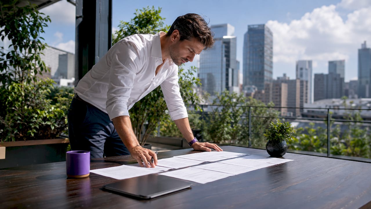 Professional reviewing ISO 27001 audit trail records