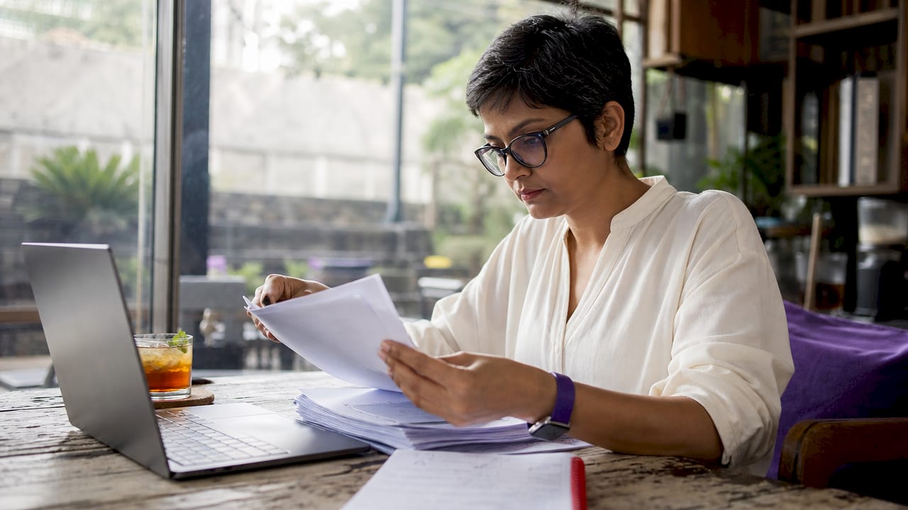 Woman reviewing ISO 27001 audit documents