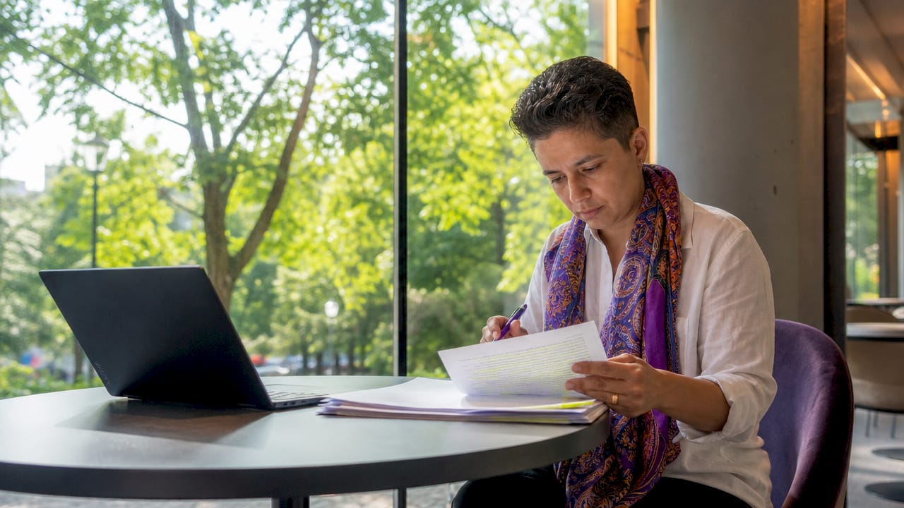 Compliance officer reviewing financial data security documents