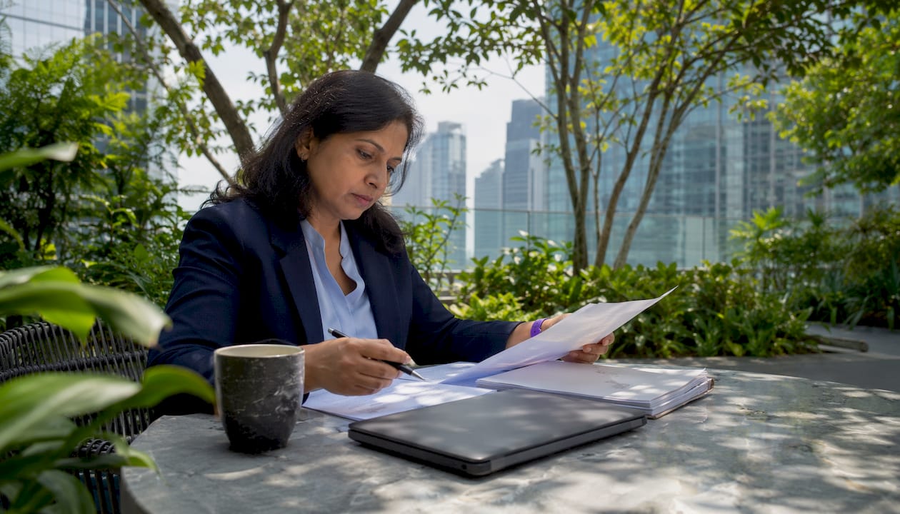 Woman reviewing software asset management documents