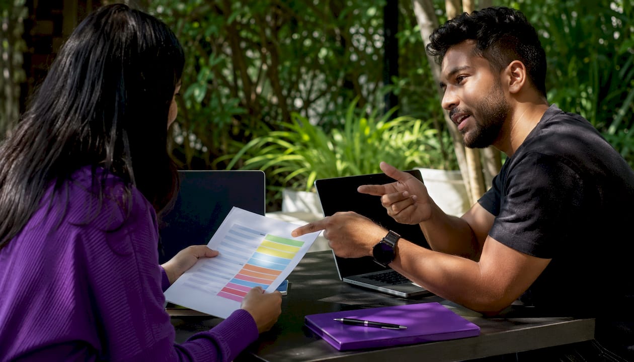 Two startup colleagues discussing cloud responsibility model