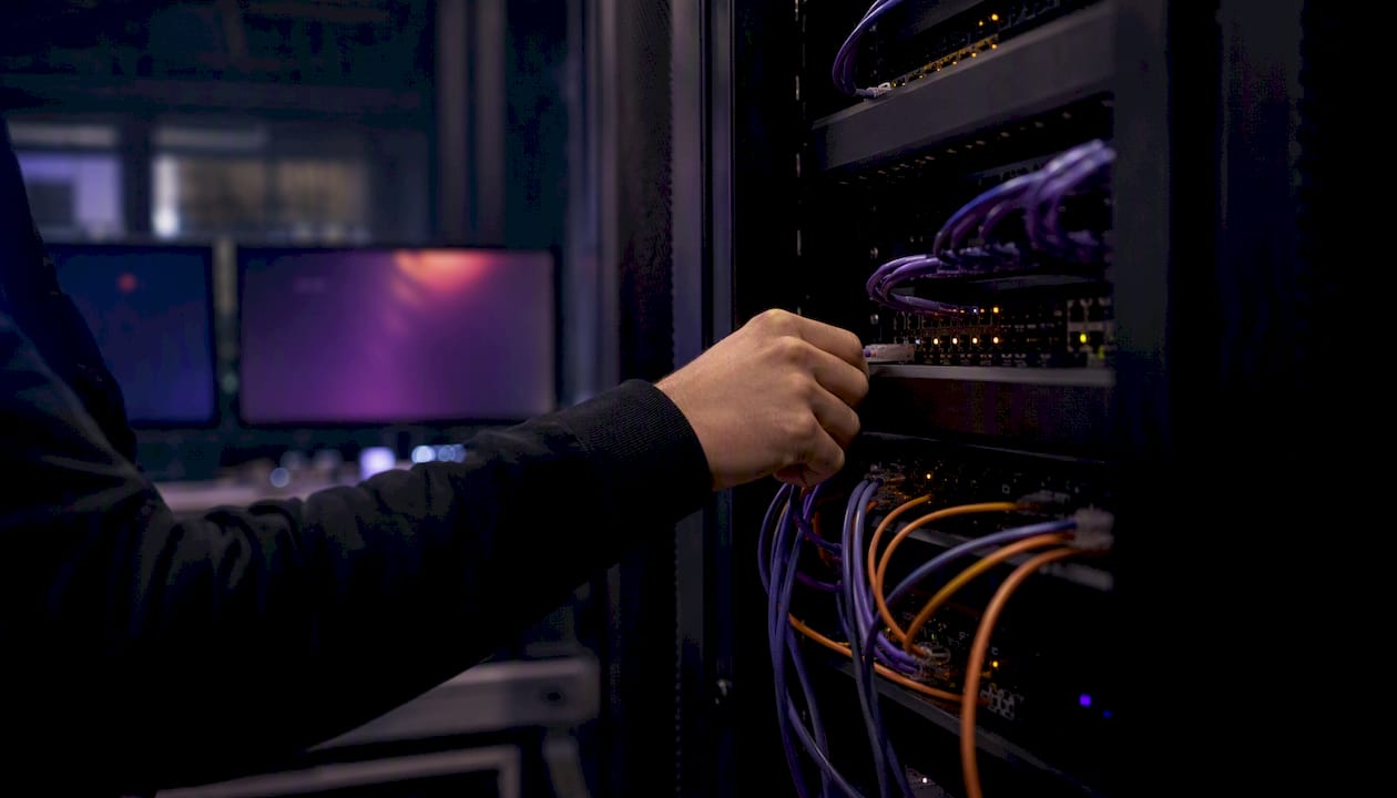 Hand adjusting cables in secure financial data center