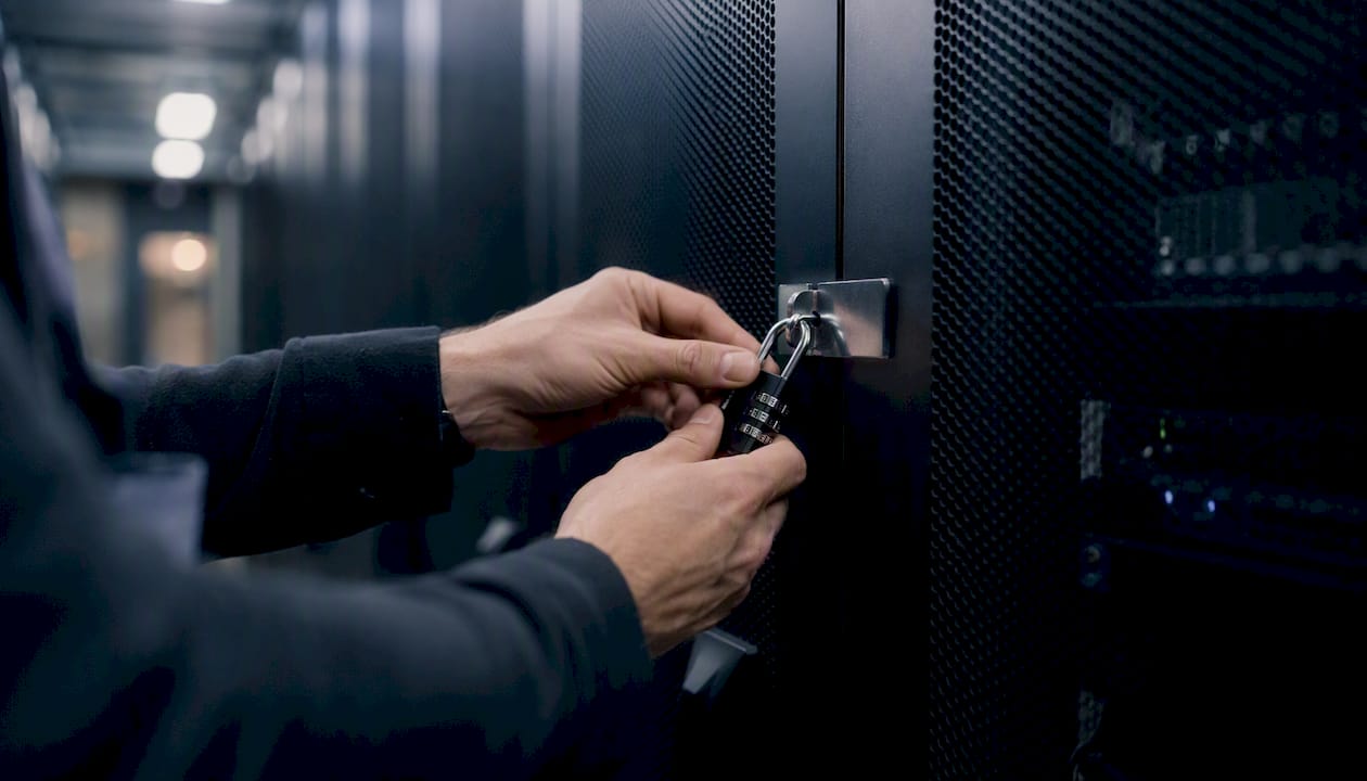 Technician locking server rack in data center