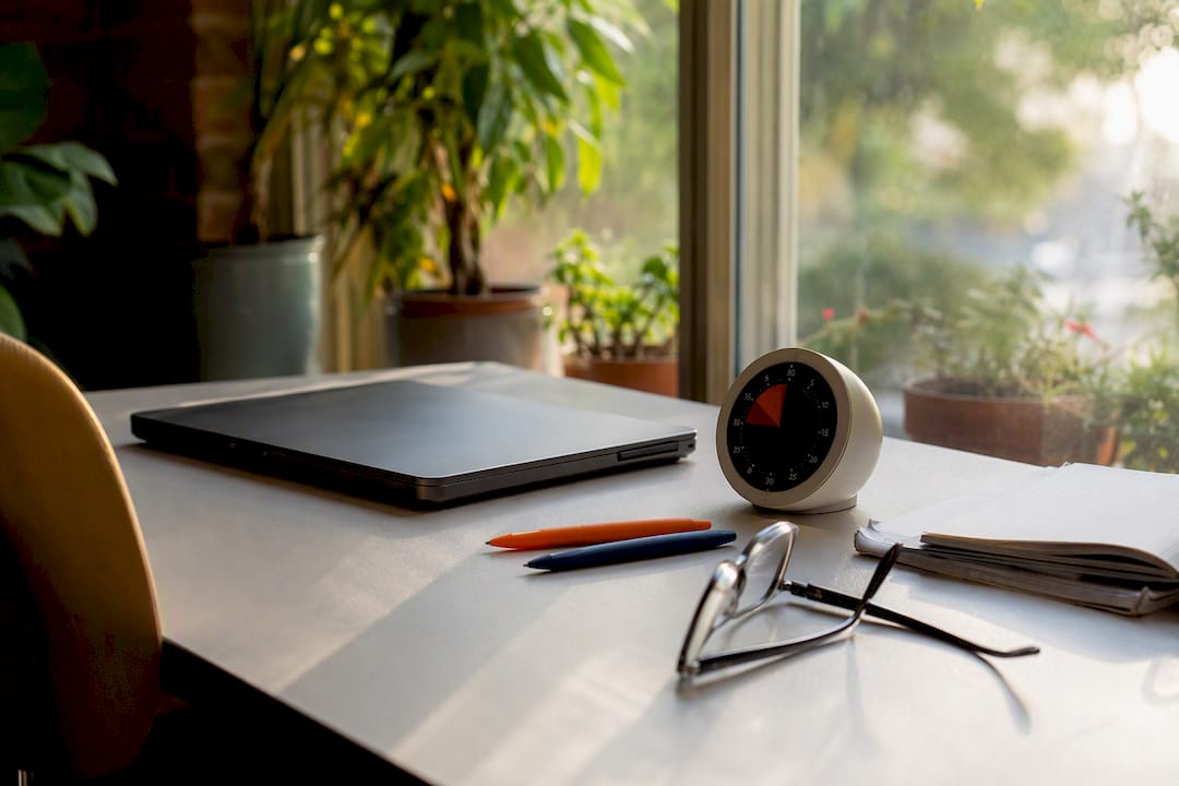 Timer and earbuds on study table