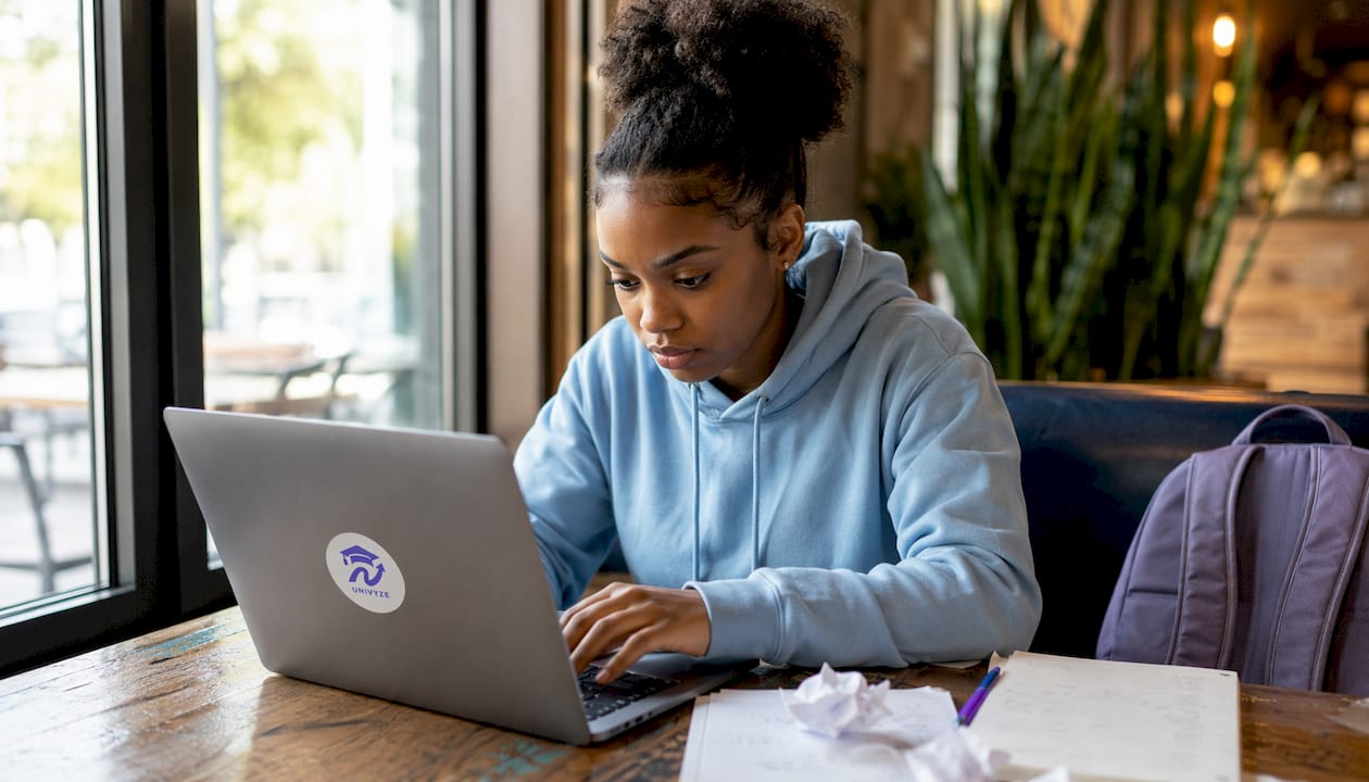 Student checking degree progress on laptop