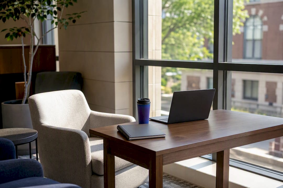 Empty study lounge corner with laptop and planner