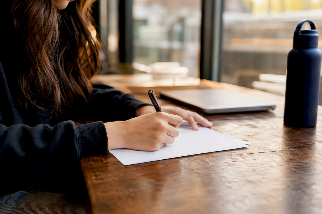 Hands filling credit overload petition