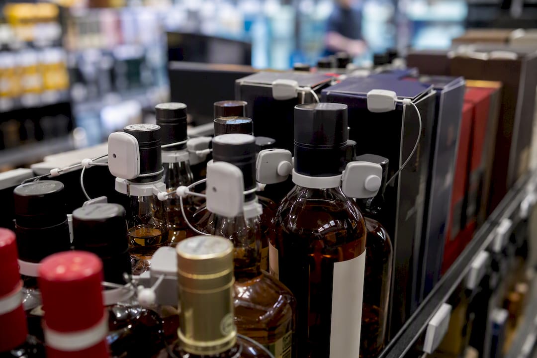 Close-up of retail product security tags on shelf