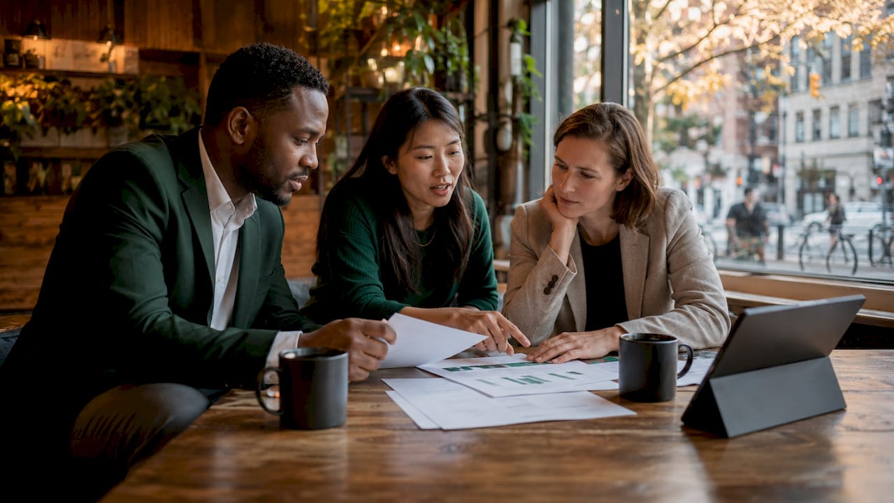 Team discussing portfolio acquisition strategy