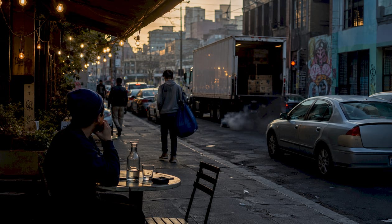 Hazy urban street with traffic and visible pollution