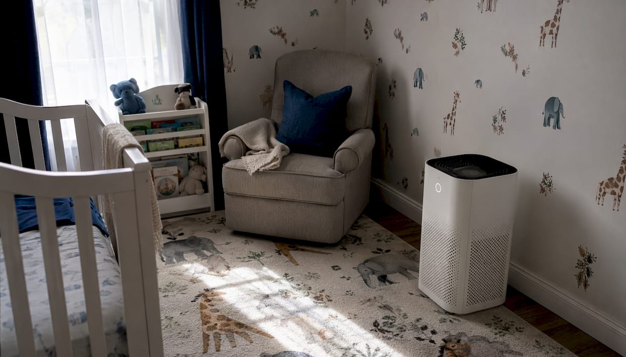 HEPA air purifier operating in toddler room corner