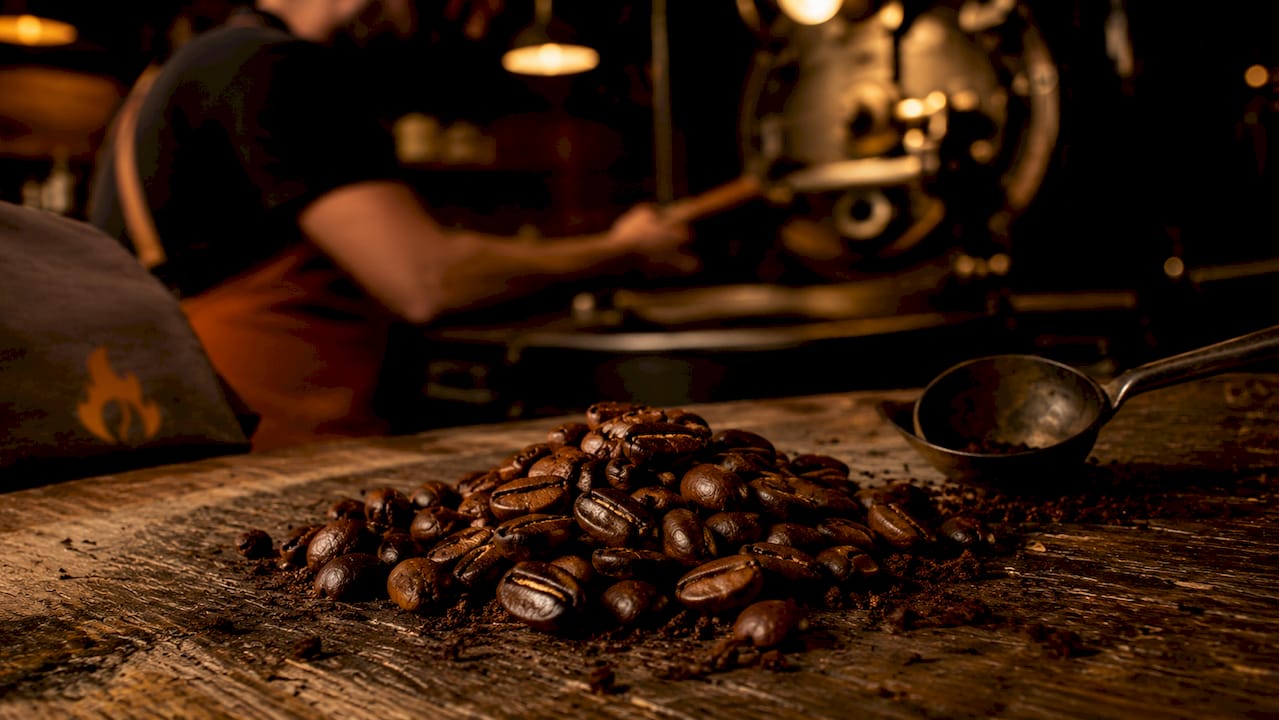 Close-up of glossy medium roast coffee beans