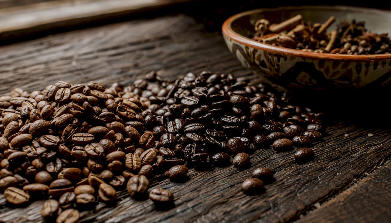 Brazilian and Colombian roasted coffee beans close-up