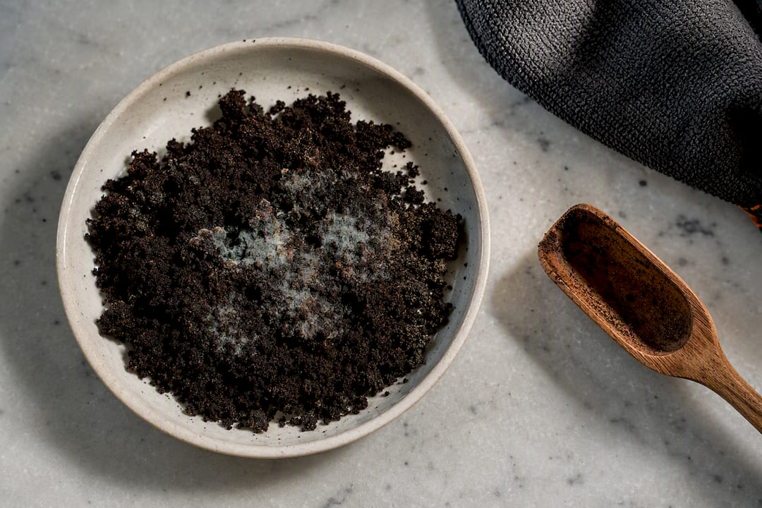 Moldy clumped coffee grounds close-up