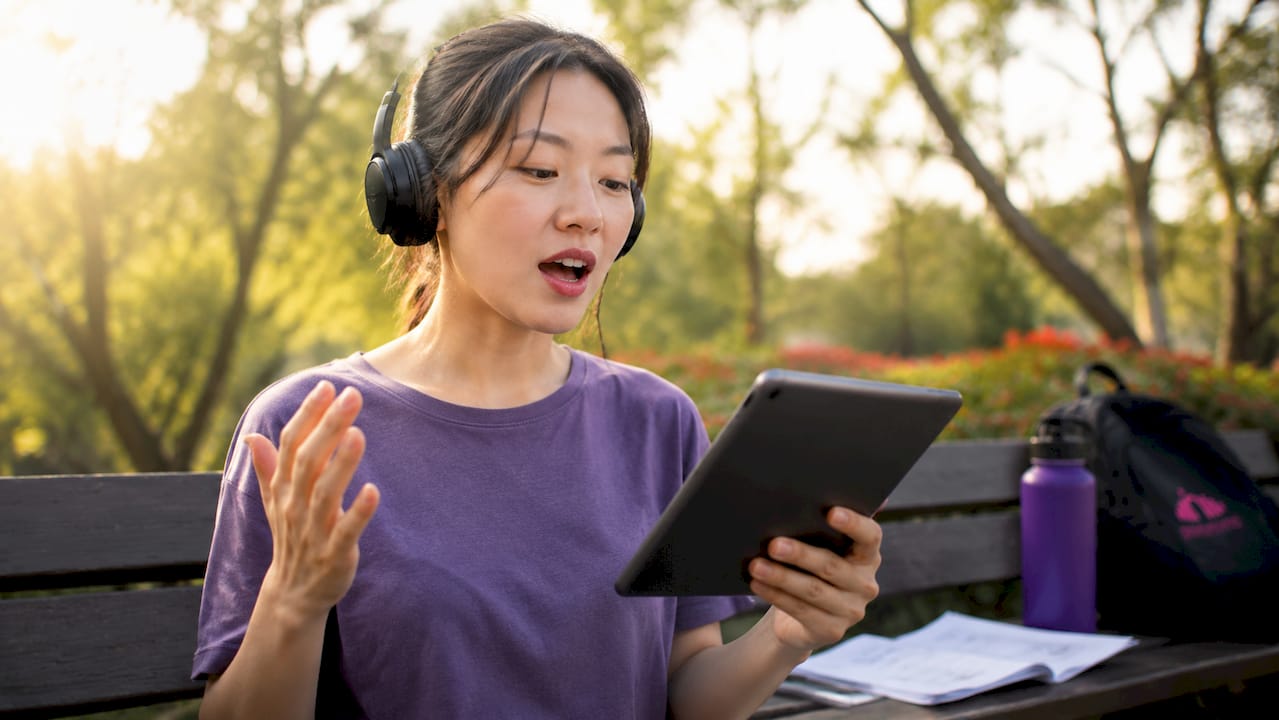 Young woman practicing pronunciation at home