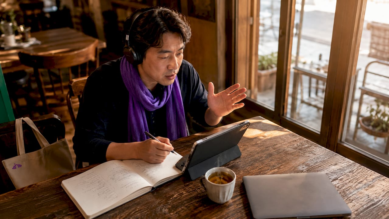Professional practicing pronunciation at home desk