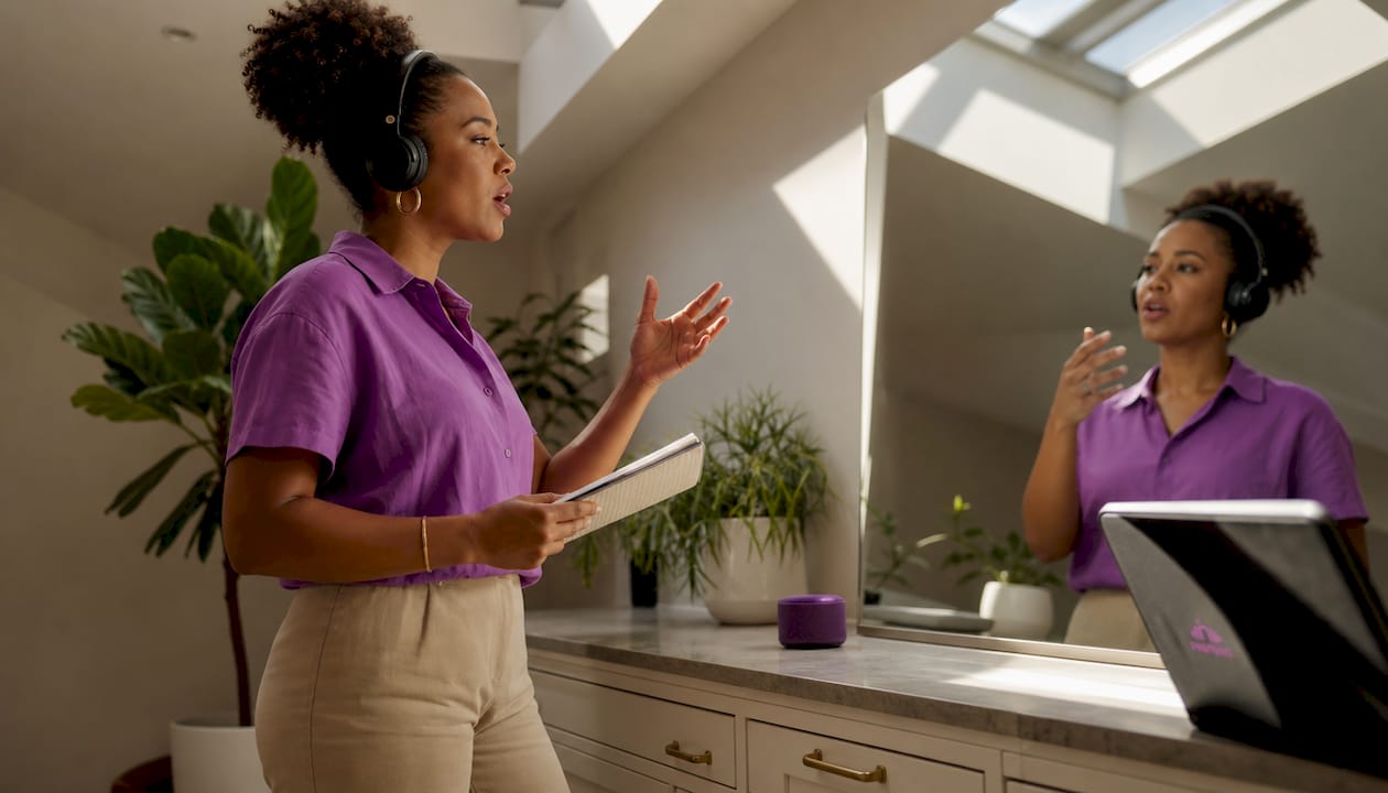 Professional woman practicing speech at home desk