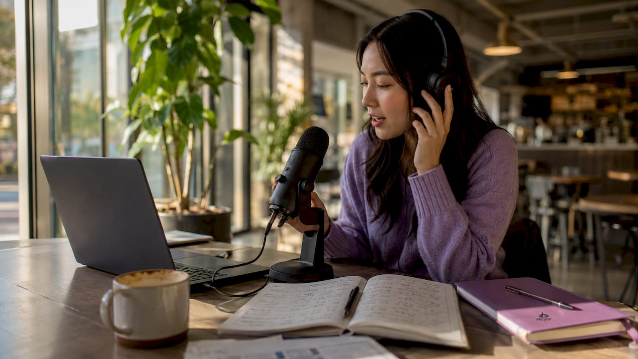 Woman practicing pronunciation at home desk