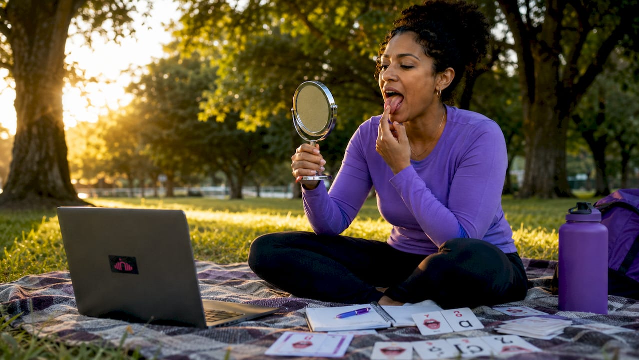 Woman practicing speech articulation in classroom