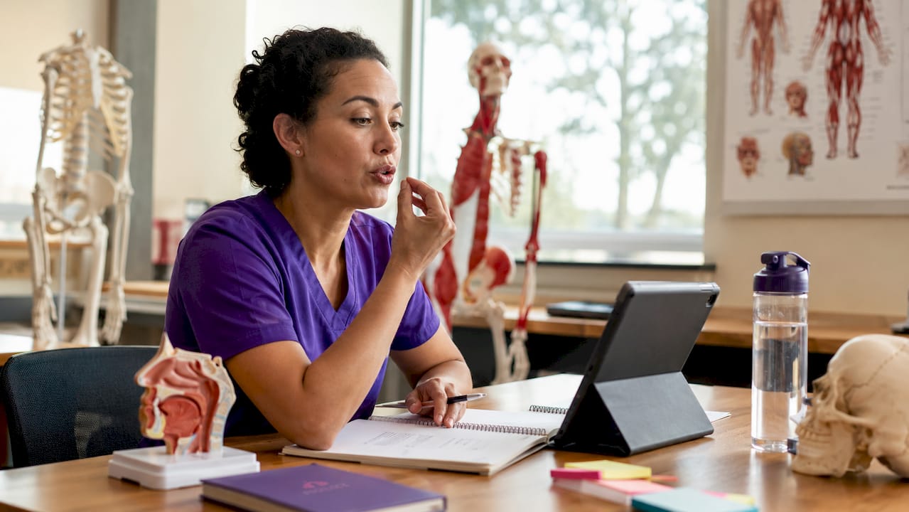 Healthcare professional practicing vowel pronunciation