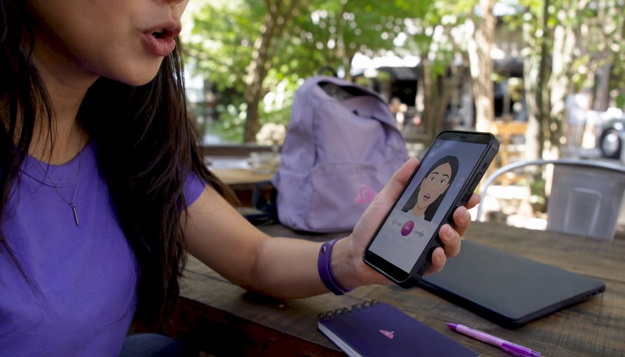 Learner using interactive mouth training tablet app