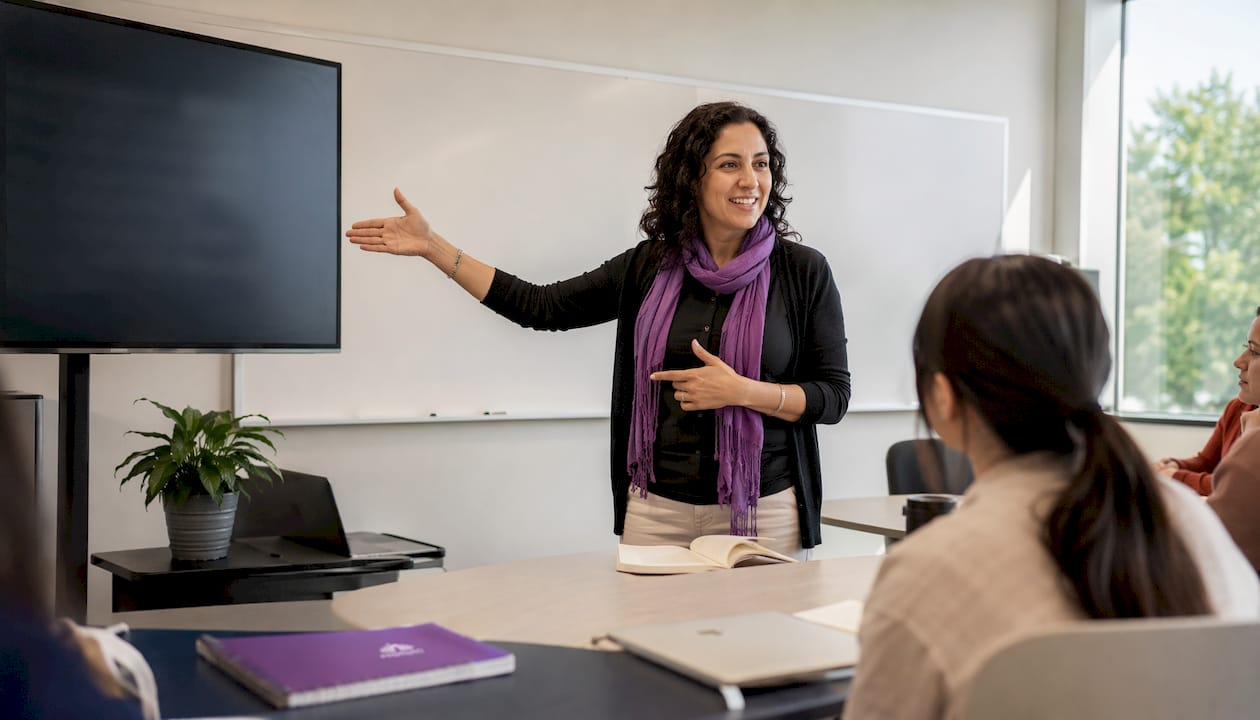 Teacher giving pronunciation feedback in classroom
