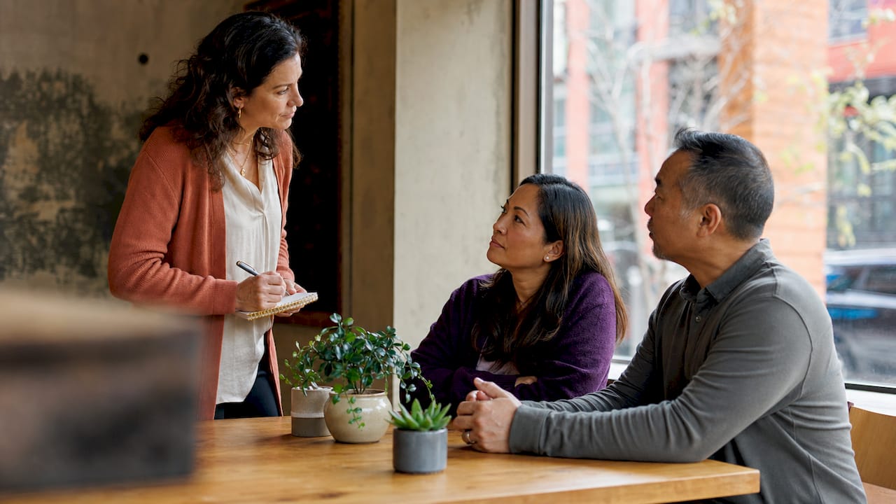 Parents in co-parenting counselling session with therapist