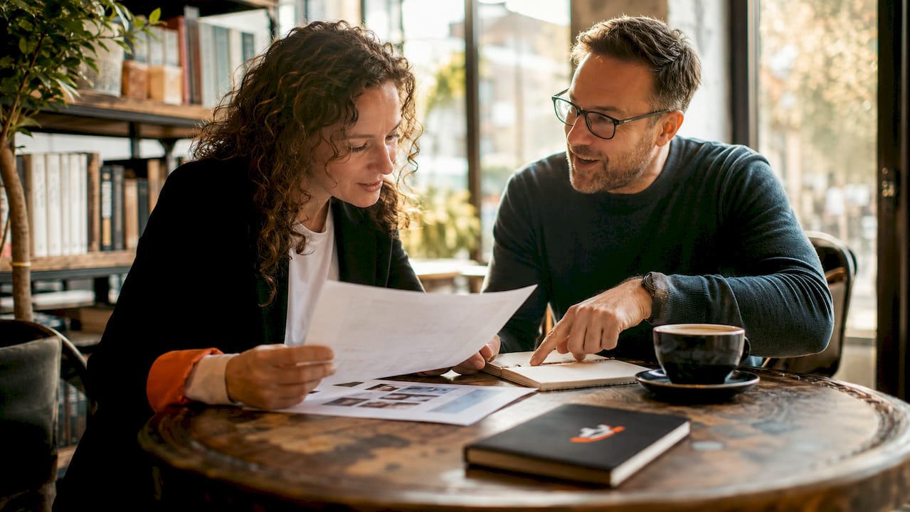 Photographer and client discussing event details