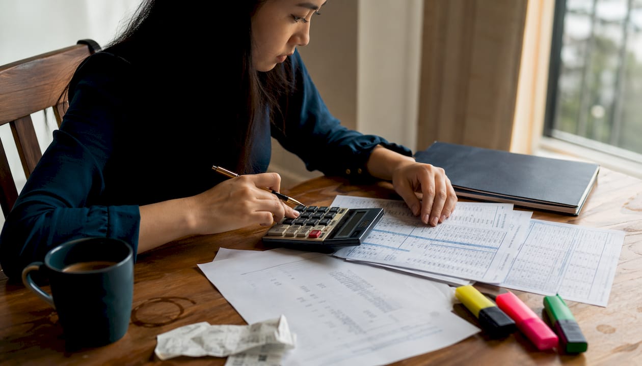 Hands calculating London home costs