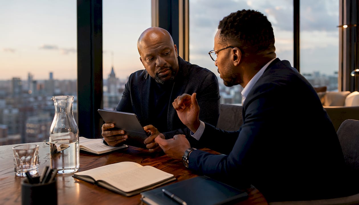Two men discussing luxury cultural experiences