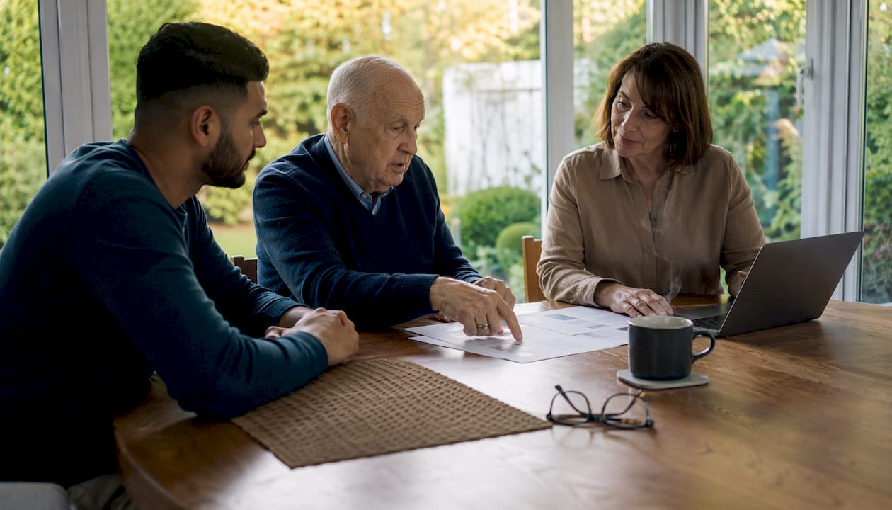 Family discussing trust types around living room table