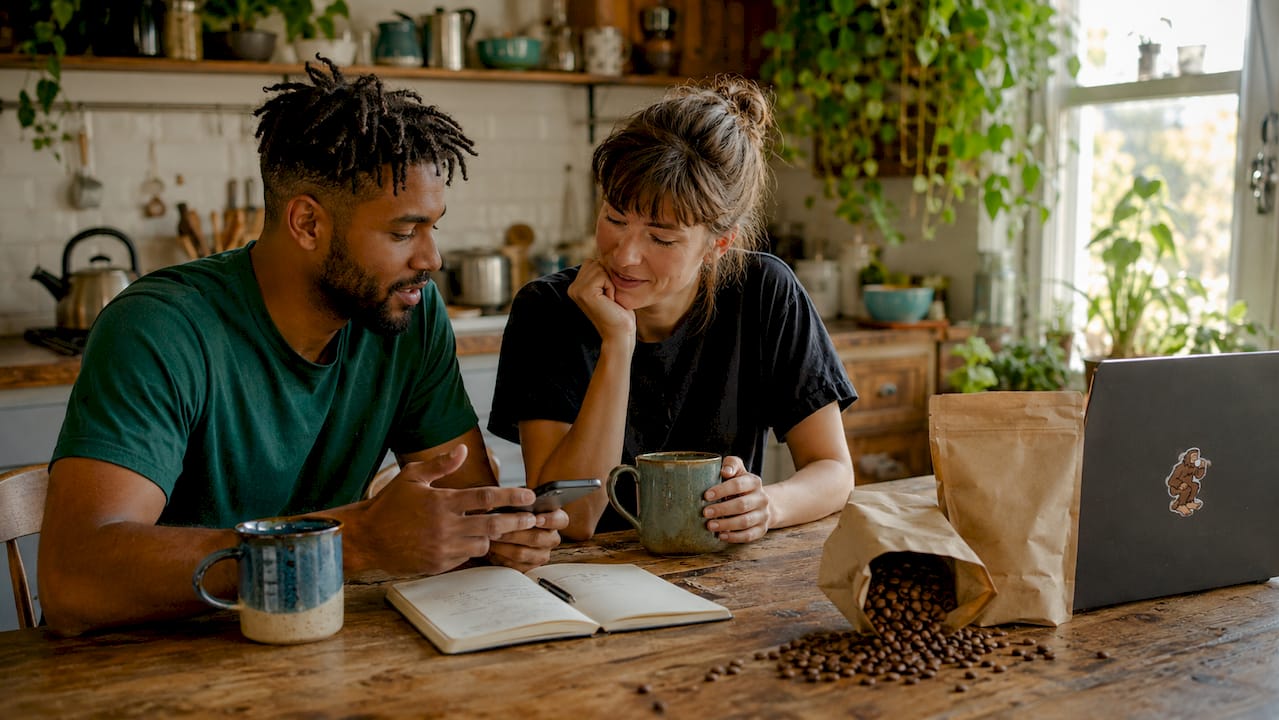 Couple tracking coffee use at home with smartphone