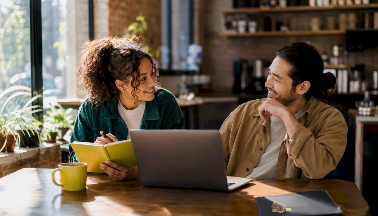 Couple discussing subscription options over laptop