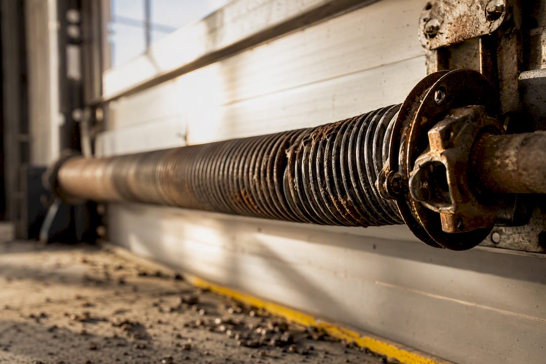 Corroded commercial garage door torsion spring close-up