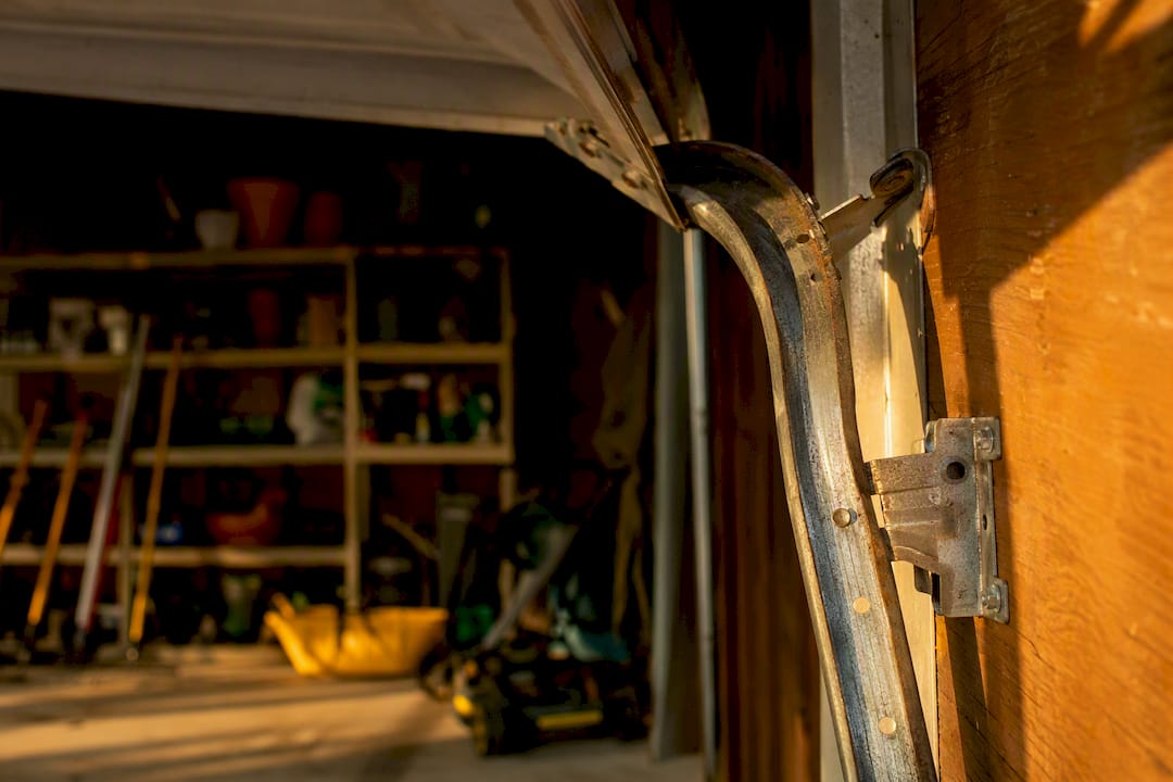 Bent garage door track close-up