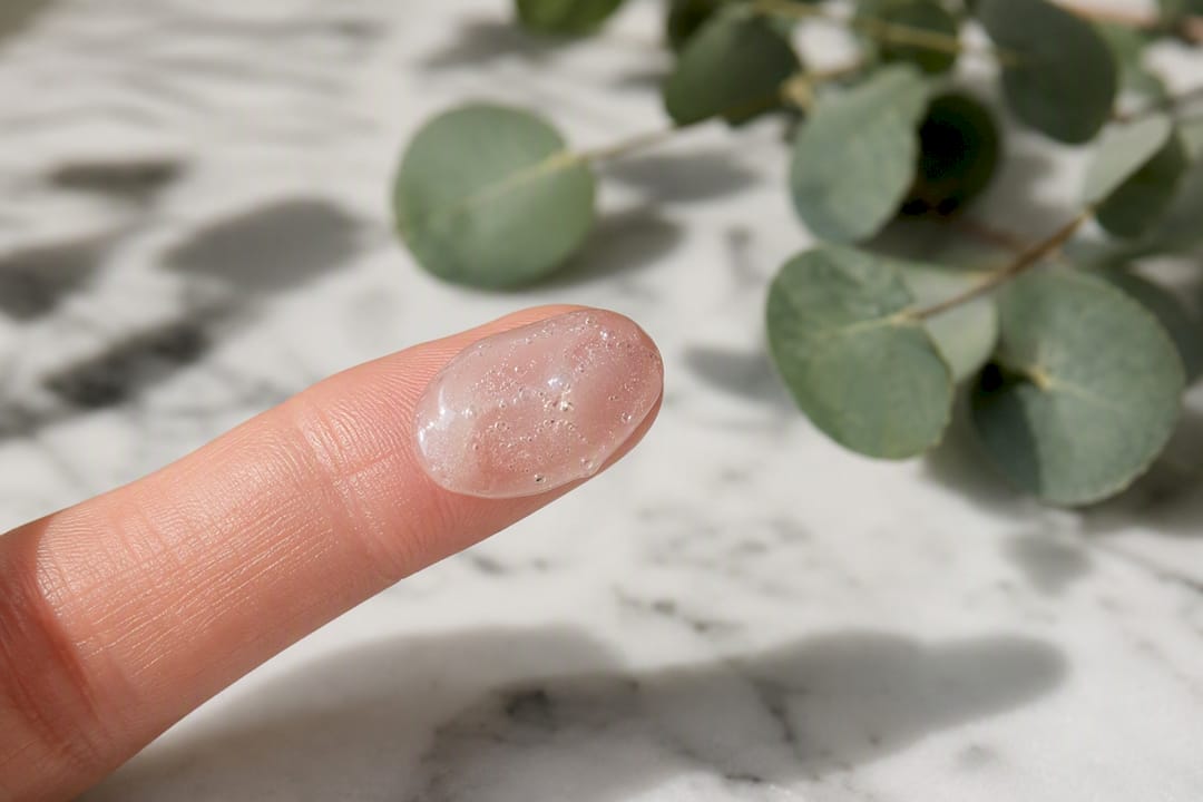 Close-up of exfoliant cream on fingertip