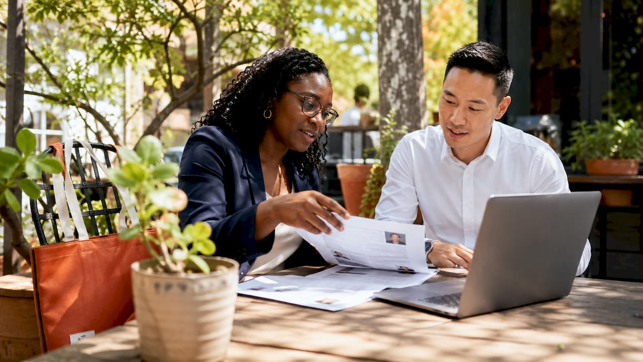 Hiring professionals discussing candidate profiles