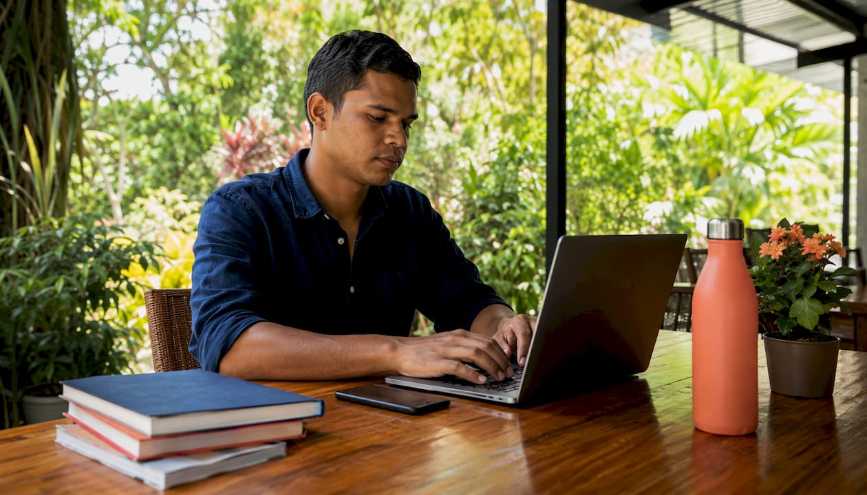 Recruiter typing on laptop in home office