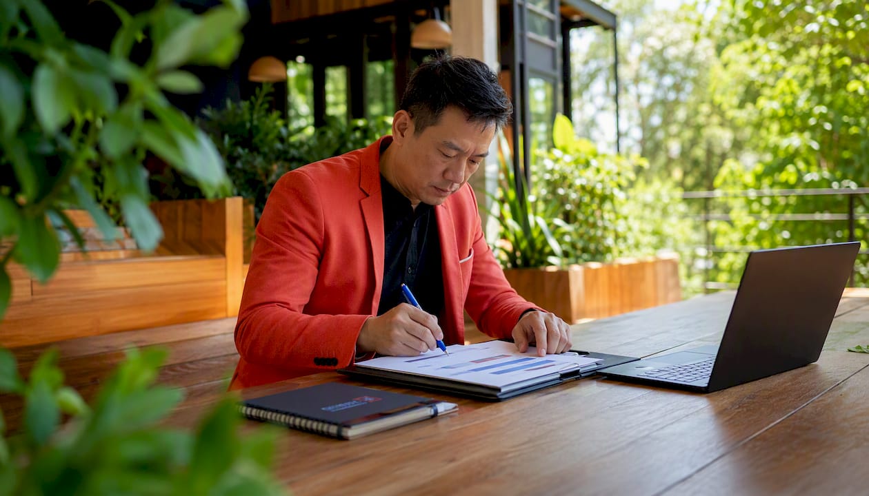 Recruiter analyzing candidate signals on paper