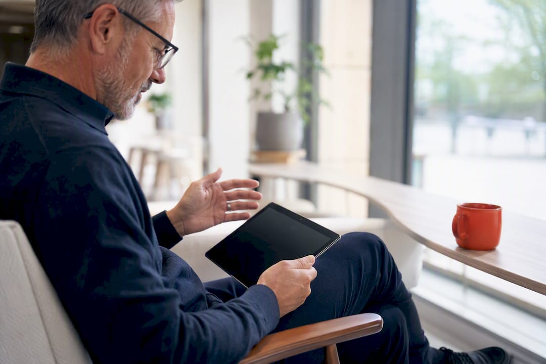 Executive hands gesturing in thoughtful hiring deliberation