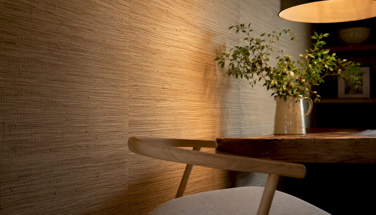 Dining room corner with grasscloth wallpaper texture
